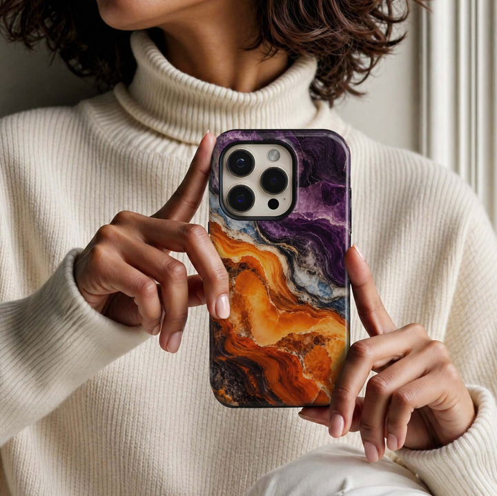 Amethyst Ember Tough iPhone Case featuring vivid amethyst purple, glowing amber orange, icy blue, ivory and smoky black agate-inspired crystal layers.