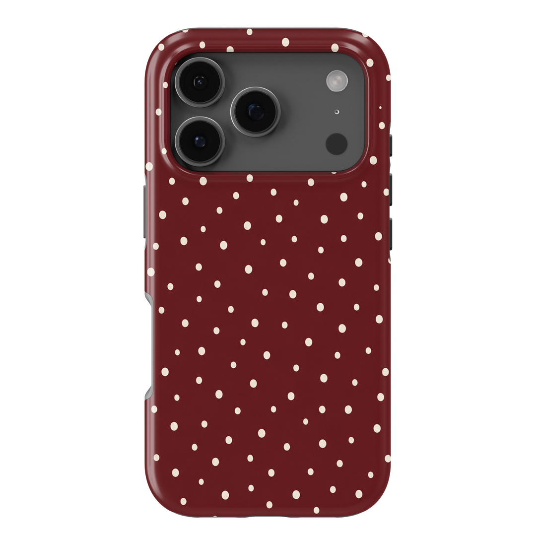 Cherry On Top dark cherry iPhone 18 Pro Max MagSafe case with scattered uneven cream polka dots on a deep burgundy red background, a cute preppy protective tough iPhone 18 Pro phone case with a feminine dotted design and MagSafe compatibility.