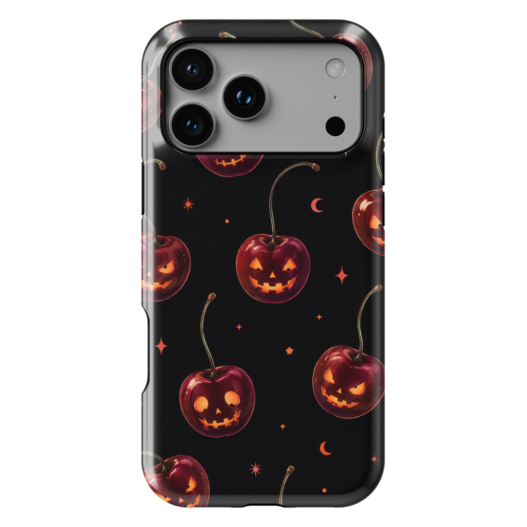Black Halloween iPhone case with cherry red jack-o-lantern pumpkins, glowing faces, crescent moons and stars.