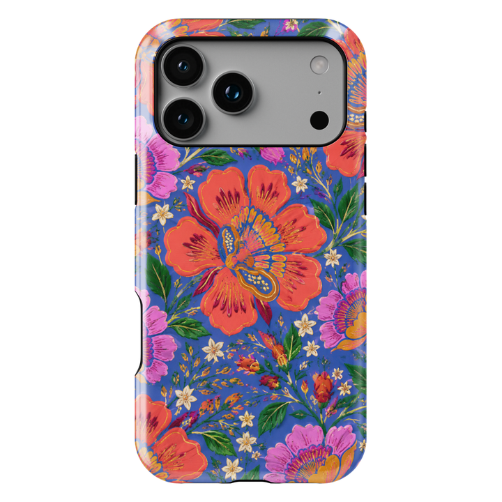 Electric Bloom iPhone case featuring vibrant coral, pink and orange flowers with green leaves on a cobalt blue background.
