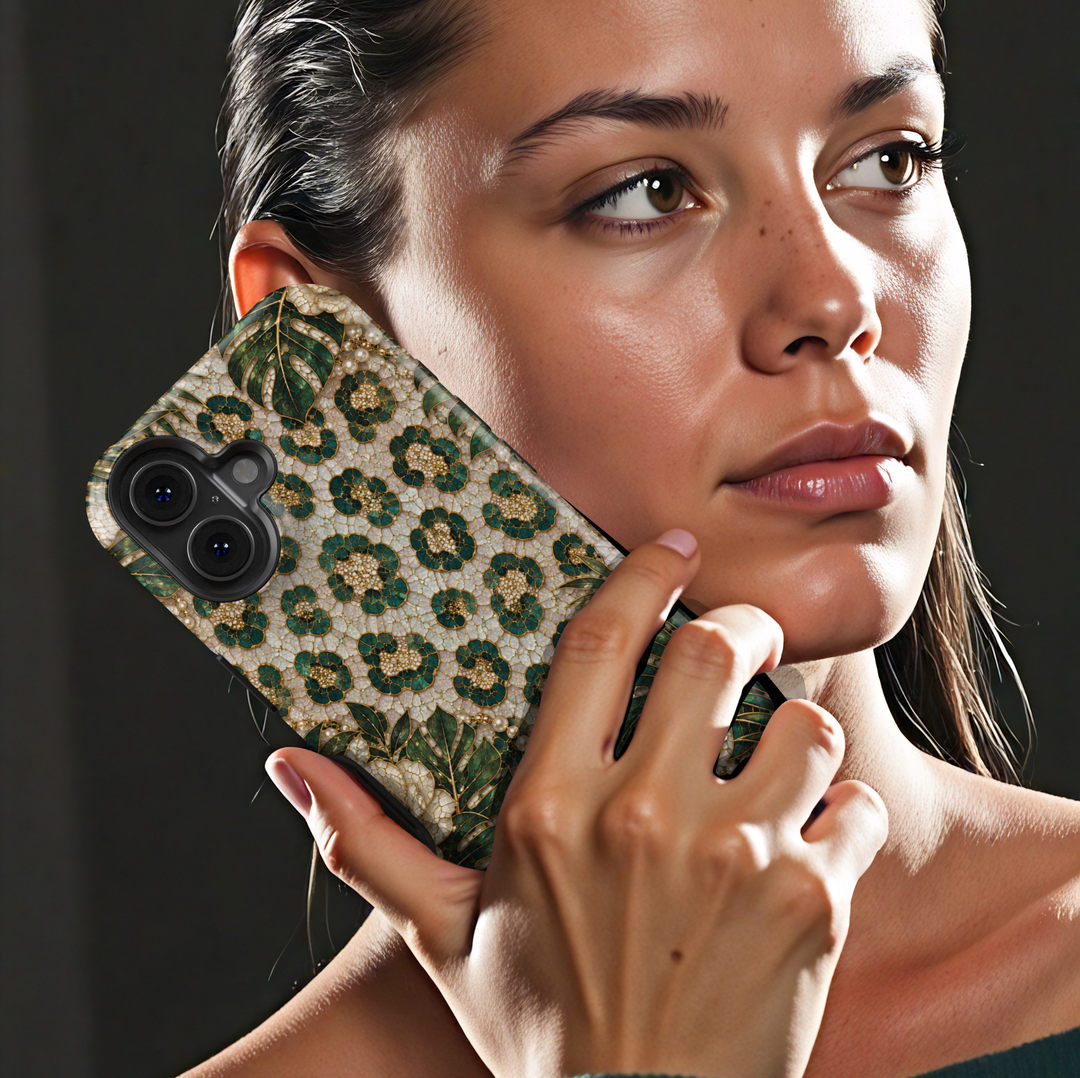 Luxury iPhone case featuring emerald green leopard print, tropical monstera leaves, ivory roses, pearls, and gold mosaic artwork.