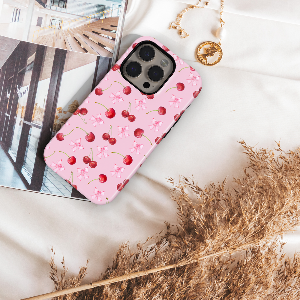 Girly pink iPhone case with black bow and star pattern – cute, aesthetic, and stylish protective phone cover for women and girls, compatible with iPhone models 14, 15, and 16.