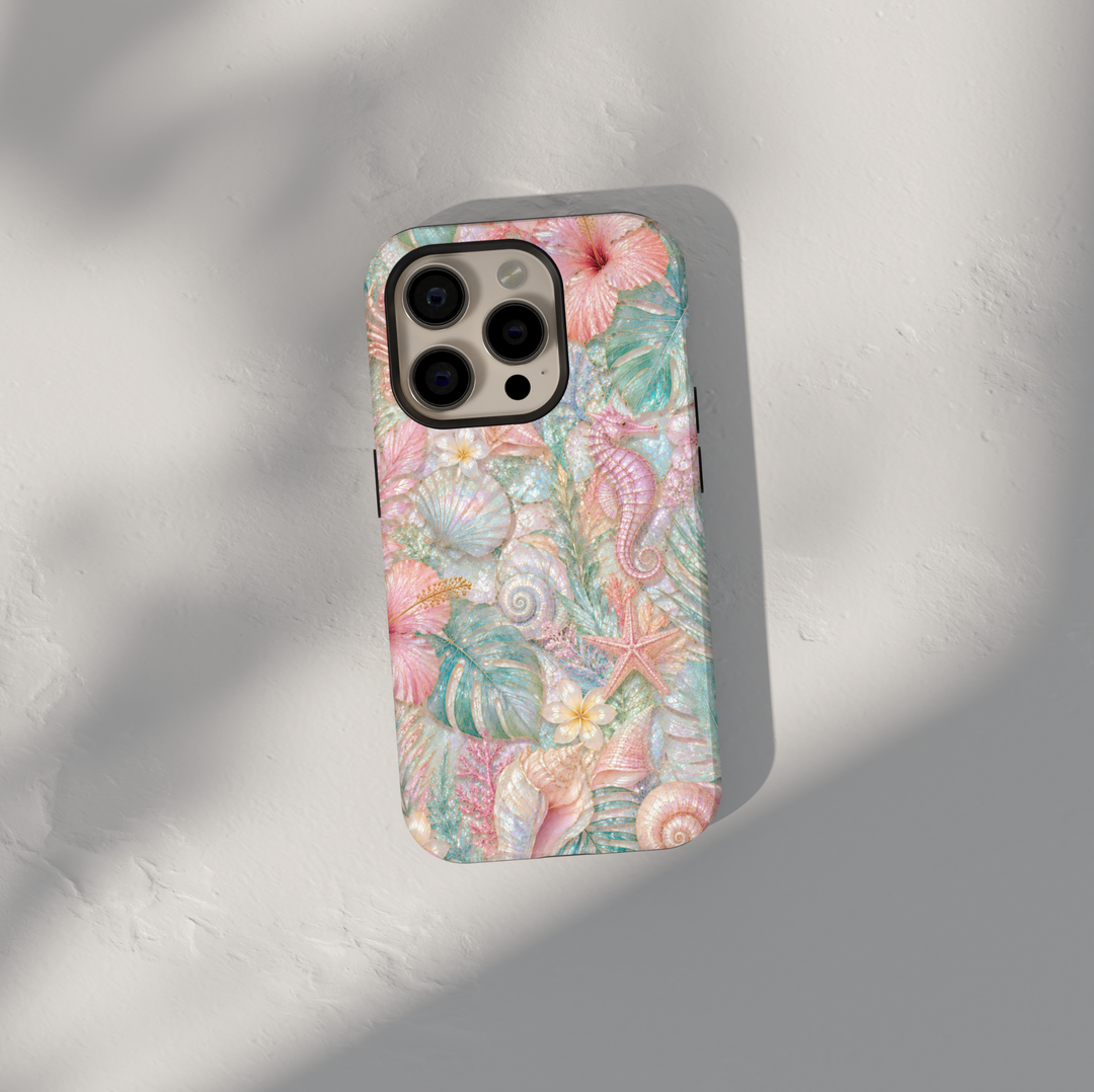 Pastel seahorse iPhone 17 Pro Max case featuring seashells, starfish, coral, tropical leaves, and luxurious coastal ocean artwork.