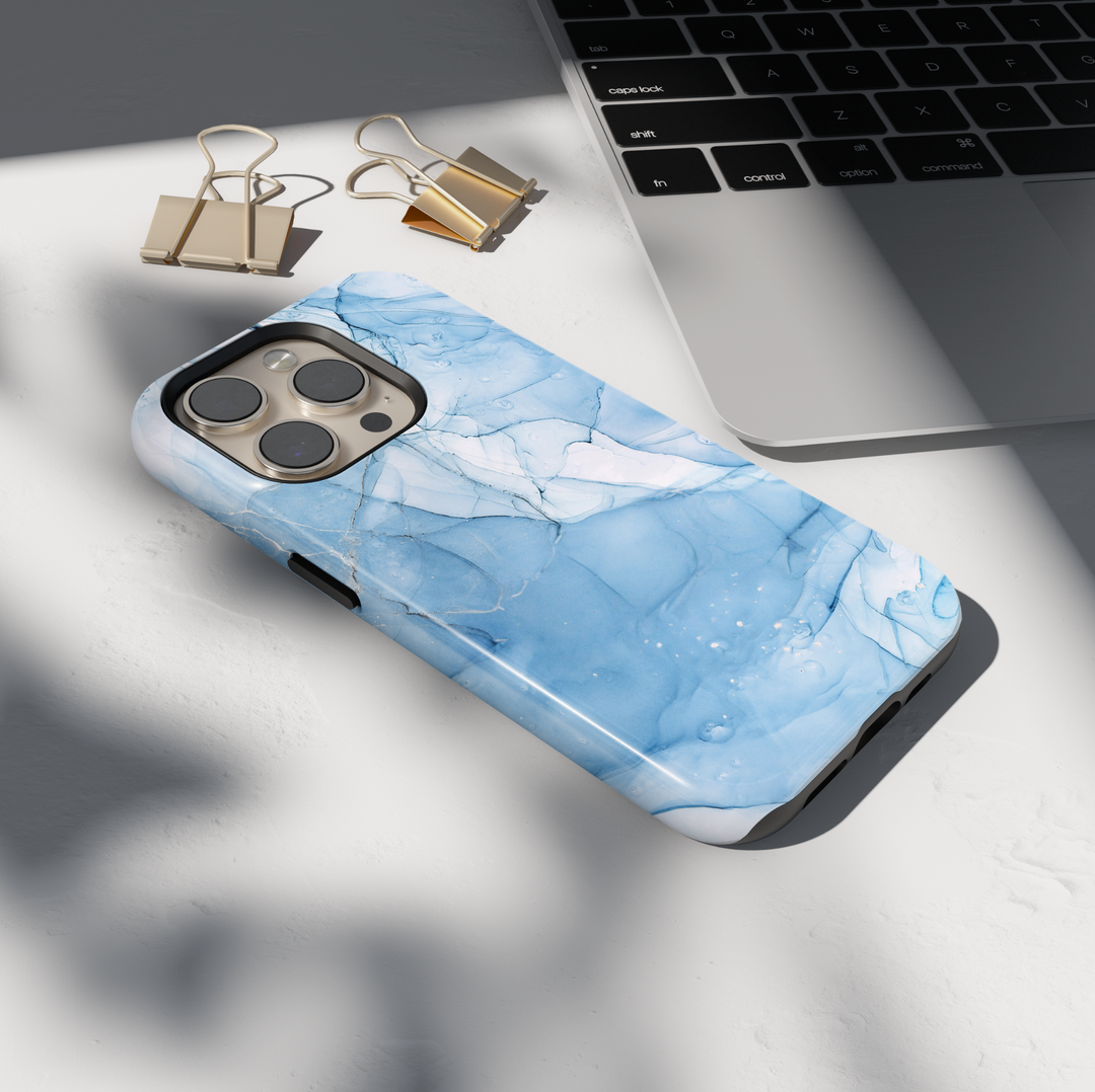 Personalized blue marble phone case with gold accents and custom name design