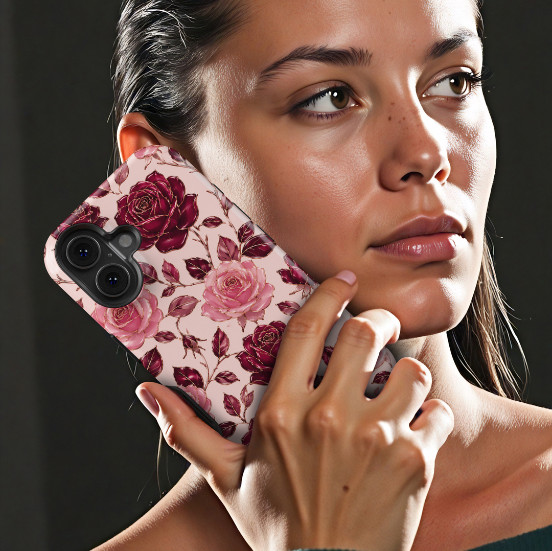 Secret Admirer burgundy rose iPhone 18 Pro Max MagSafe case featuring large blush pink and deep wine-red roses, burgundy leaves and delicate gold-toned floral outlines on a pale blush background, an elegant romantic tough iPhone 18 Pro floral phone case with feminine luxury aesthetic and MagSafe compatibility.