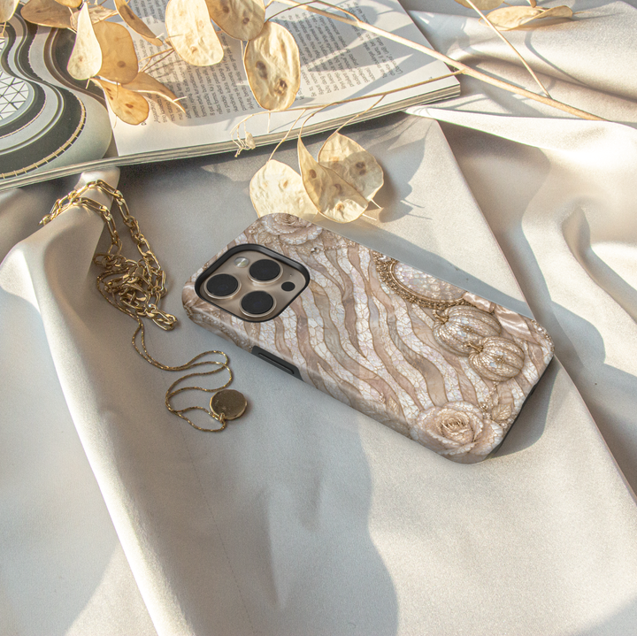 Luxury iPhone case featuring pearl zebra stripes, ivory roses, champagne pumpkins, bows, and elegant mosaic artwork.