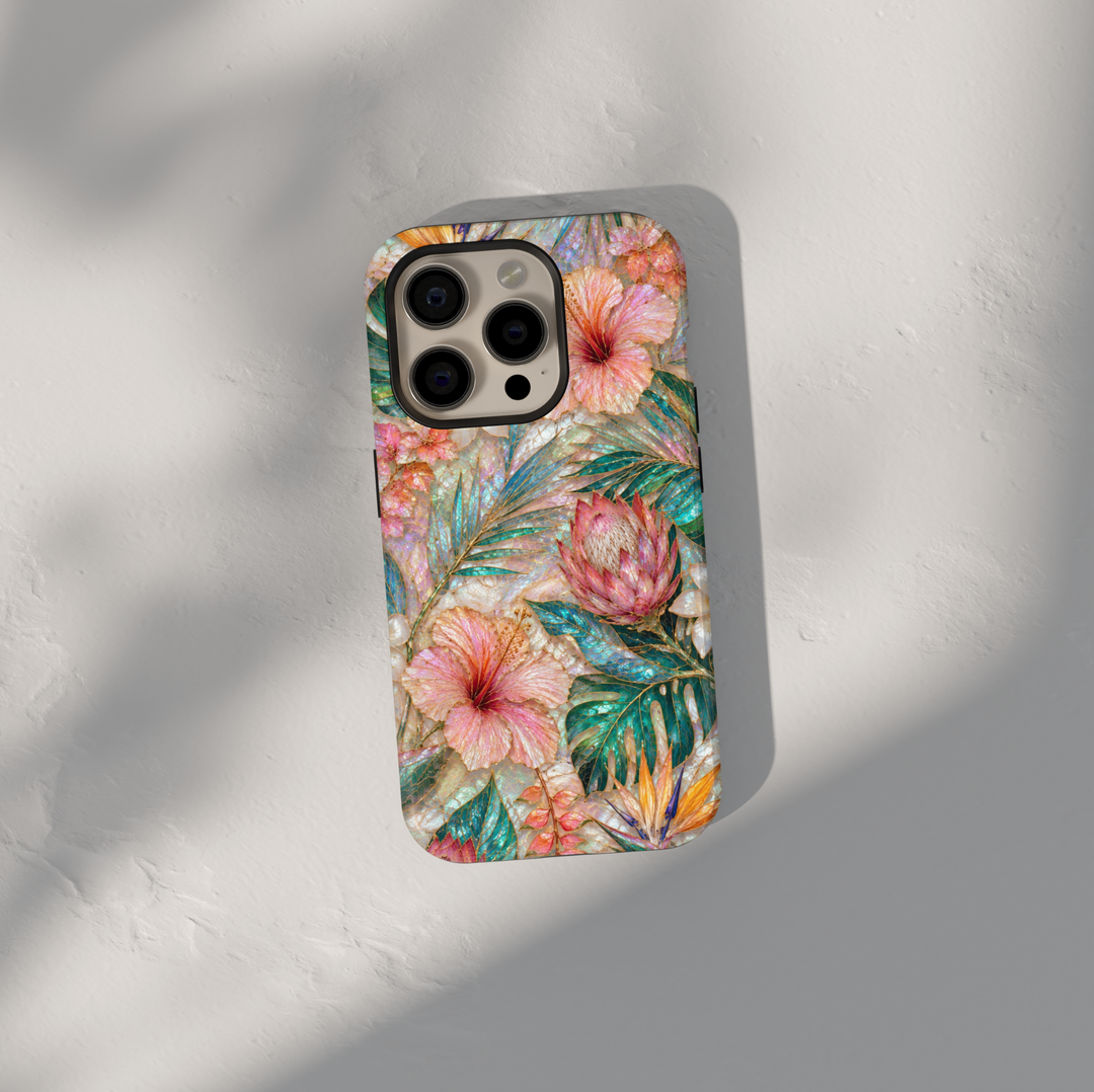 Tropical floral iPhone 17 Pro Max case featuring hibiscus flowers, protea blooms, bird of paradise, and teal botanical leaves.