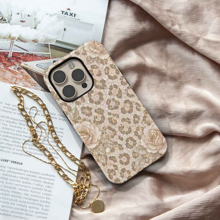 Luxury iPhone case featuring pearl snow leopard print, ivory roses, champagne gold accents, and elegant neutral mosaic artwork.