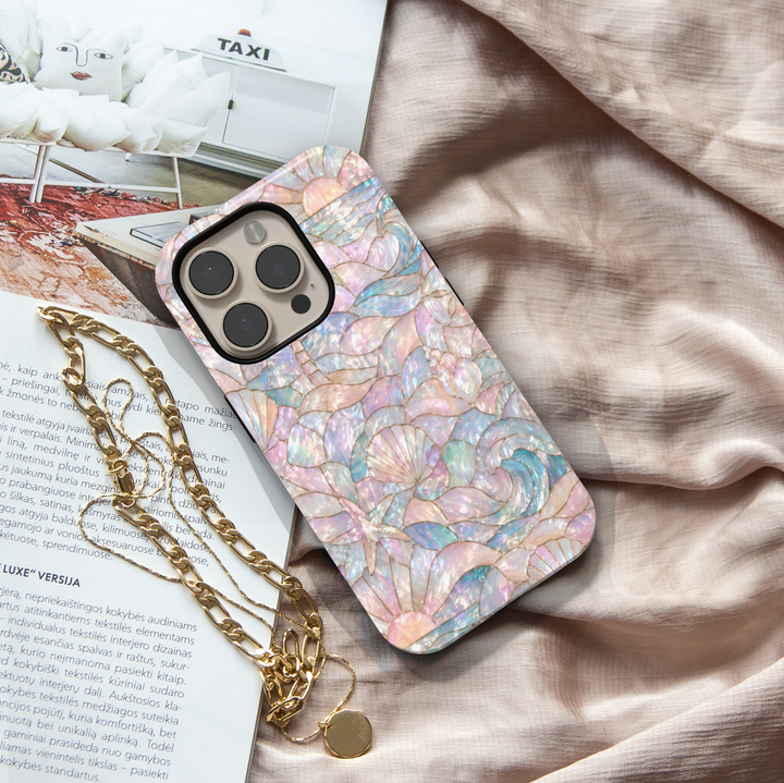 Iridescent ocean beach iPhone 17 Pro Max case with seashells, waves, and pastel pearl mosaic design, MagSafe tough case.