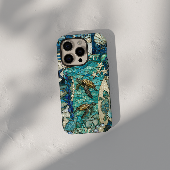 Sea turtle coastal iPhone 17 Pro Max case featuring ocean waves, surfboards, shells, pearls, and tropical beach artwork.