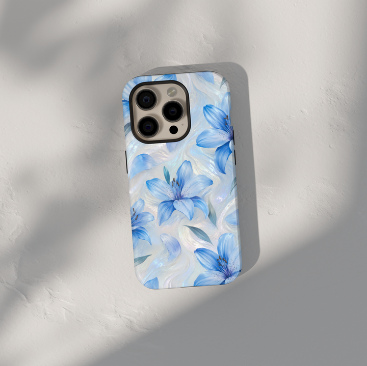 Blue lily floral iPhone case featuring delicate flowers on an iridescent pearl swirl background.