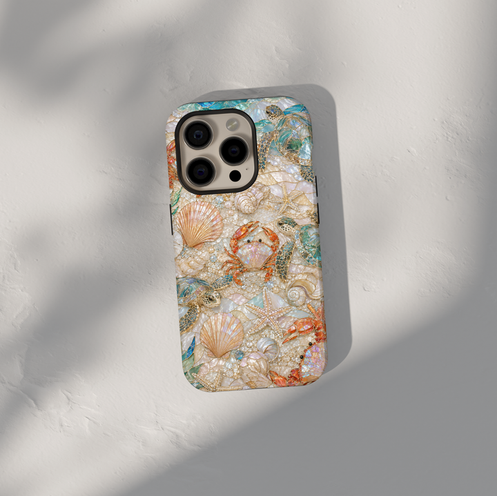 Beach-themed iPhone case featuring sea turtles, seashells, starfish, crabs, pearl accents, and coastal ocean-inspired artwork.