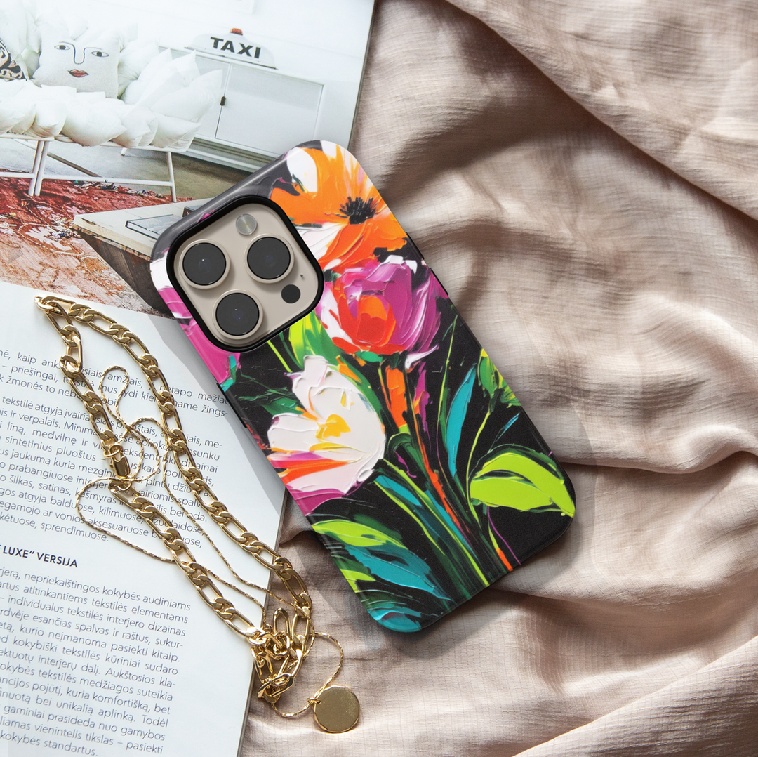 Modern abstract floral iPhone case featuring vibrant colorful flowers with white blossoms on a dark artistic background.
