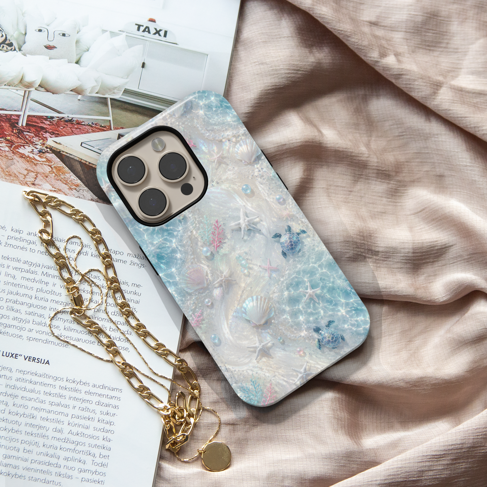 Sea turtle iPhone case featuring seashells, starfish, coral accents, and shimmering ocean waves in soft aqua tones.