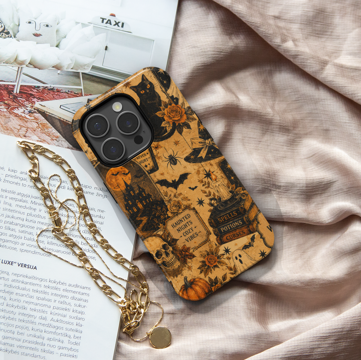 Vintage Halloween phone case for iPhone and Samsung Galaxy featuring black cats, ghosts, pumpkins, skull, bats, haunted house, potions and gothic illustrations in orange and black.