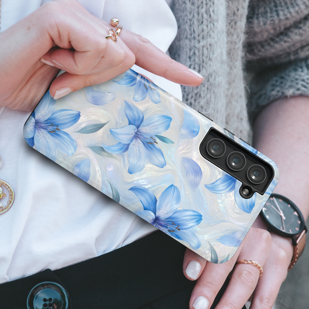 Elegant blue lily Samsung Galaxy phone case with pearl-inspired floral artwork and soft botanical details.