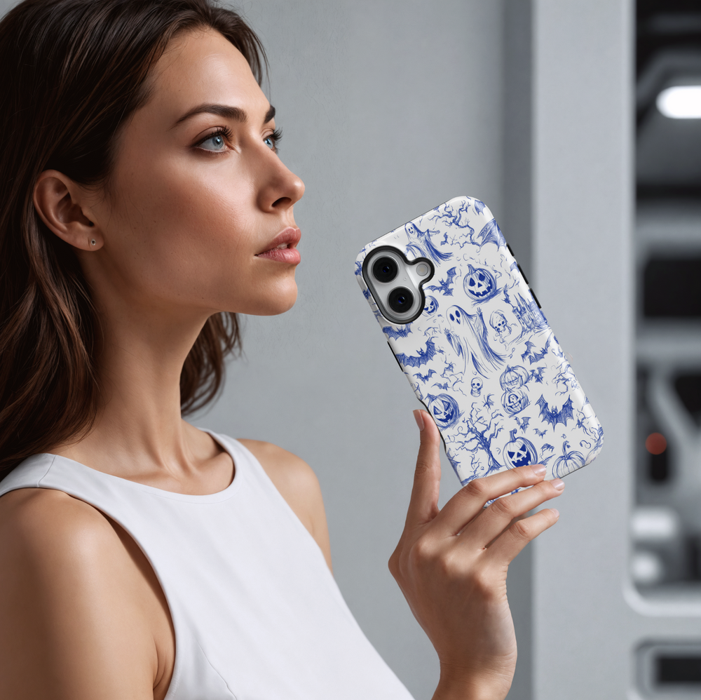 Halloween phone case with blue sketch illustrations of ghosts, bats, jack-o'-lanterns, haunted trees, skulls, and a spooky castle on a white background.