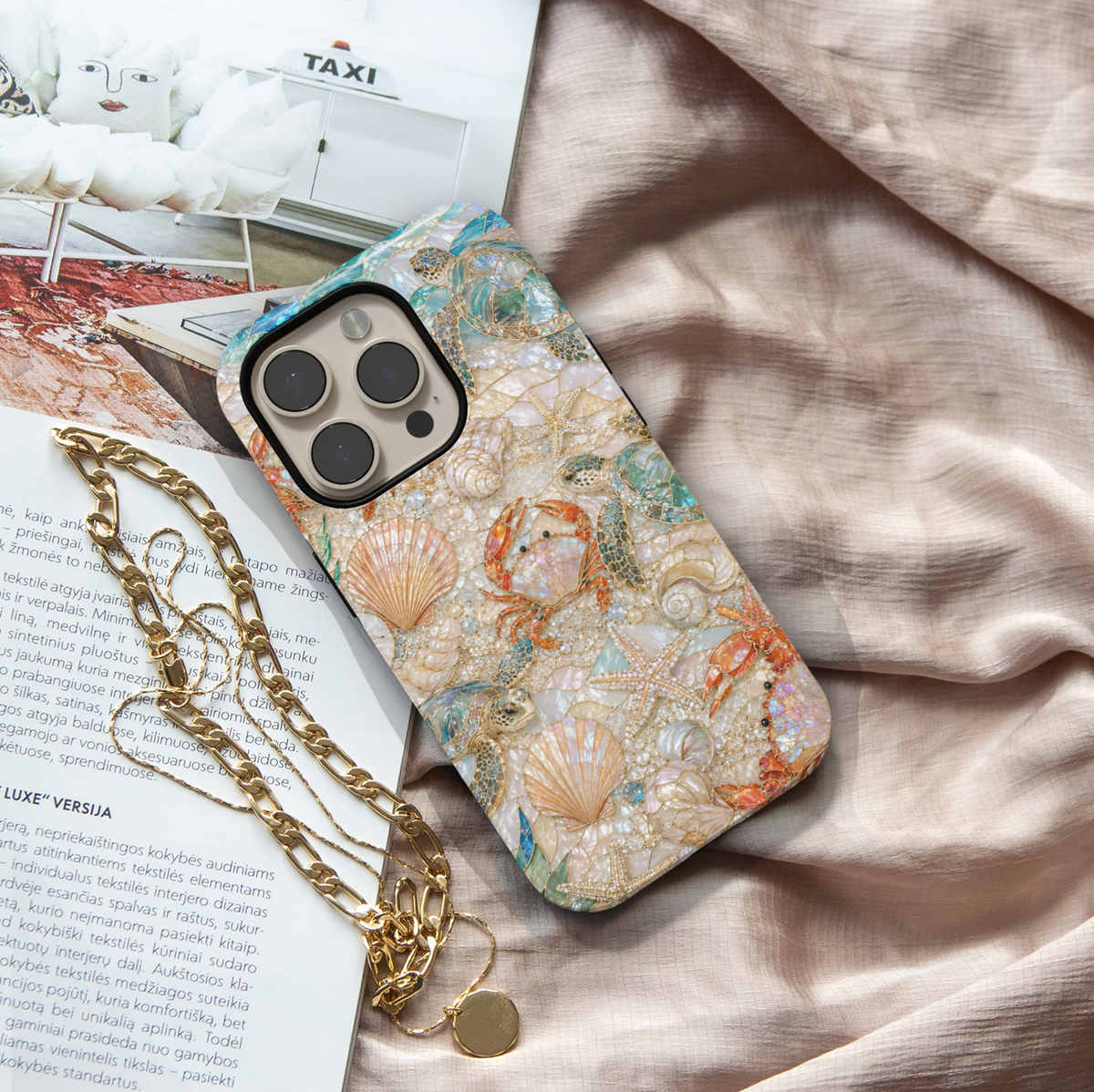 Beach-themed iPhone case featuring sea turtles, seashells, starfish, crabs, pearl accents, and coastal ocean-inspired artwork.