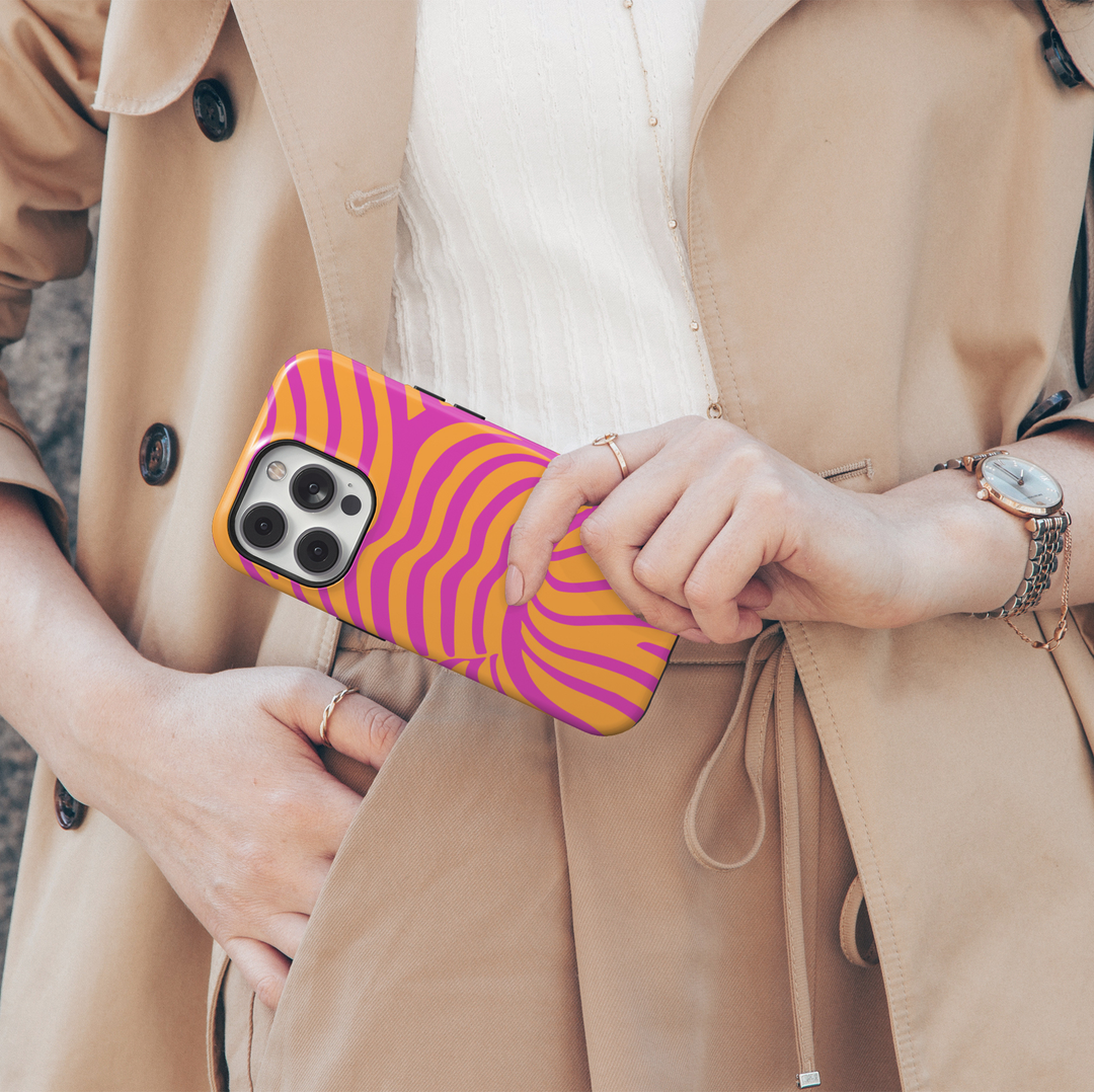 Electric Sunset pink and orange iPhone 18 Pro Max MagSafe case featuring bold hot pink, magenta and bright orange abstract wavy lines, a colorful retro groovy tough iPhone 18 Pro phone case with funky Y2K aesthetic, protective design and MagSafe compatibility.