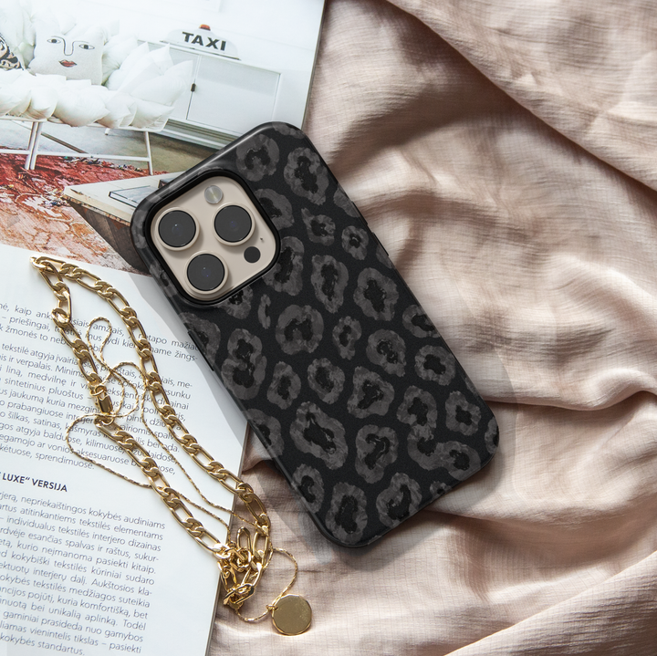 Black iPhone case leopards, botanical details and a luxurious black background.