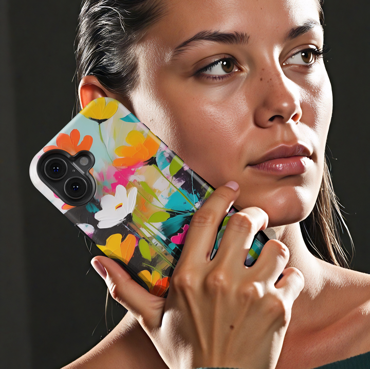 Modern abstract floral iPhone case featuring vibrant colorful flowers with white blossoms on a dark artistic background.