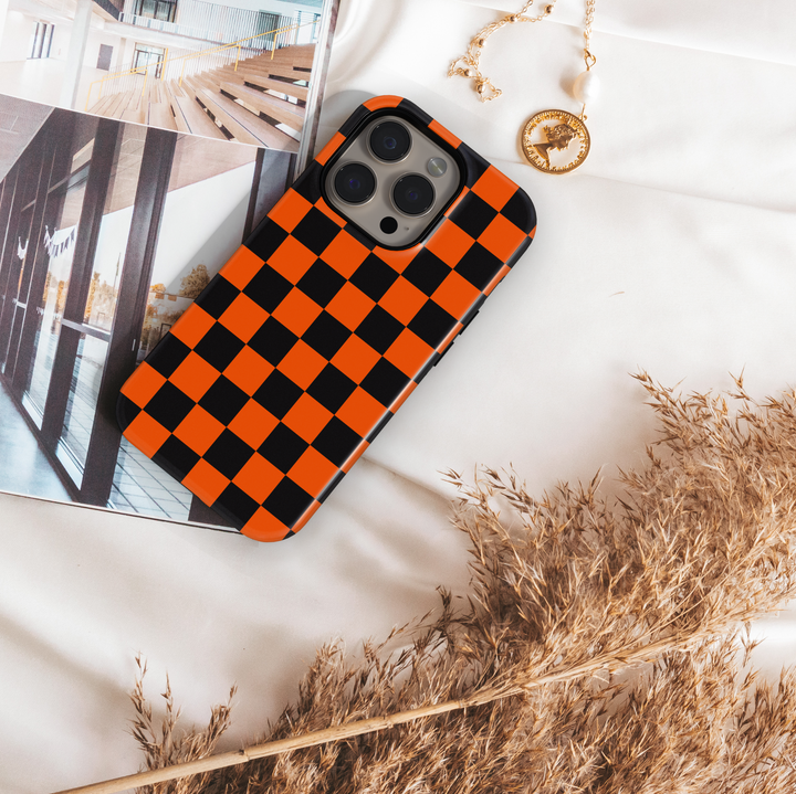 Orange and black checkerboard tough phone case with gold monogram initials – chic protective iPhone and Samsung cover