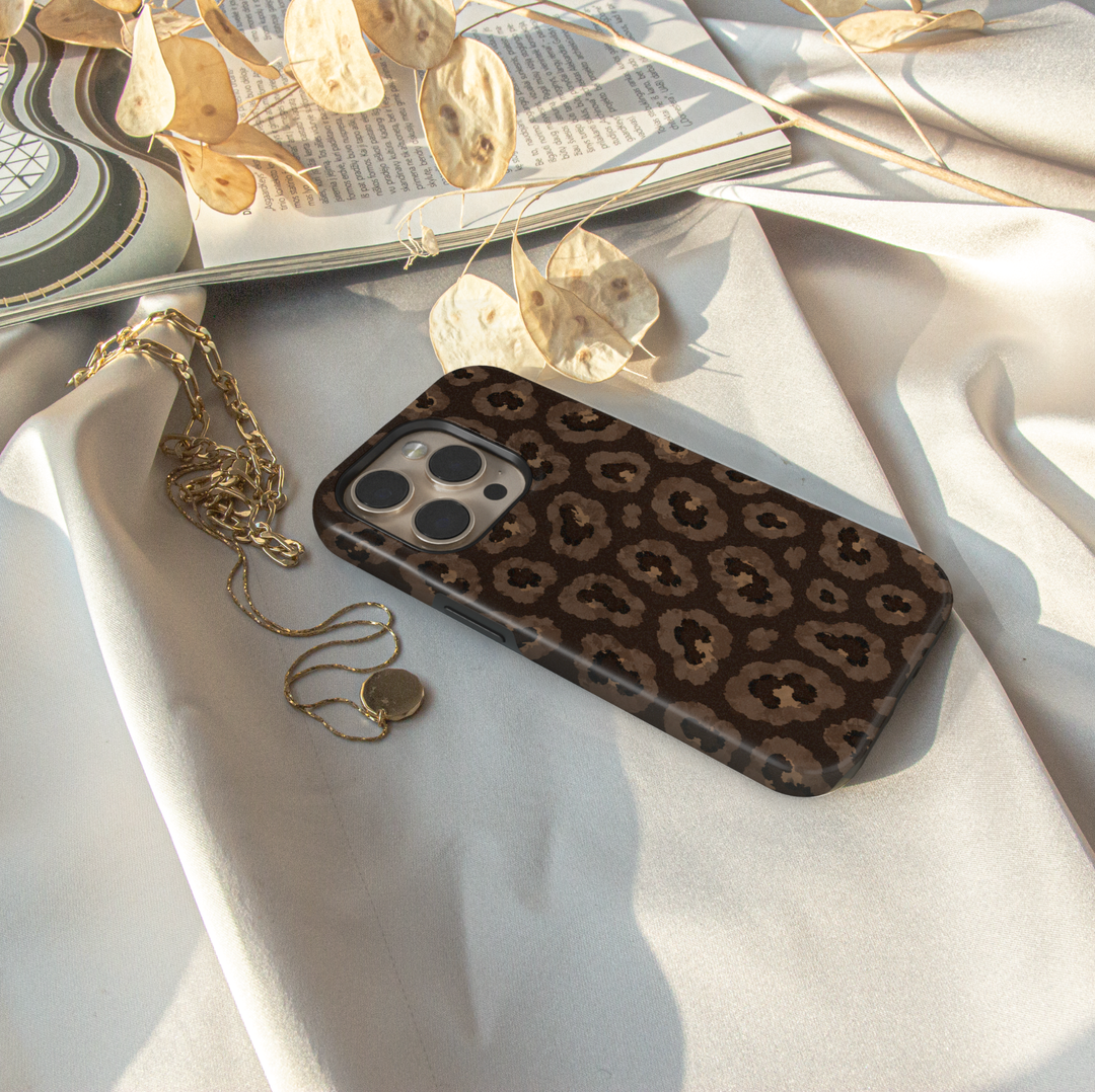 Smoky Leopard iPhone case featuring realistic taupe, brown, charcoal and black leopard animal print.