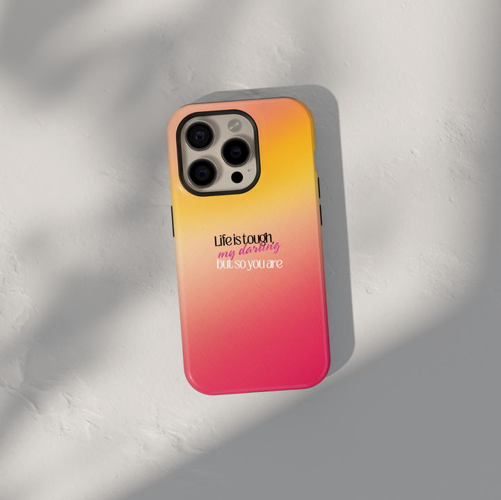 Motivational quote phone case with life is tough but so are you text on sunset gradient background for iPhone and Samsung Galaxy protective case.