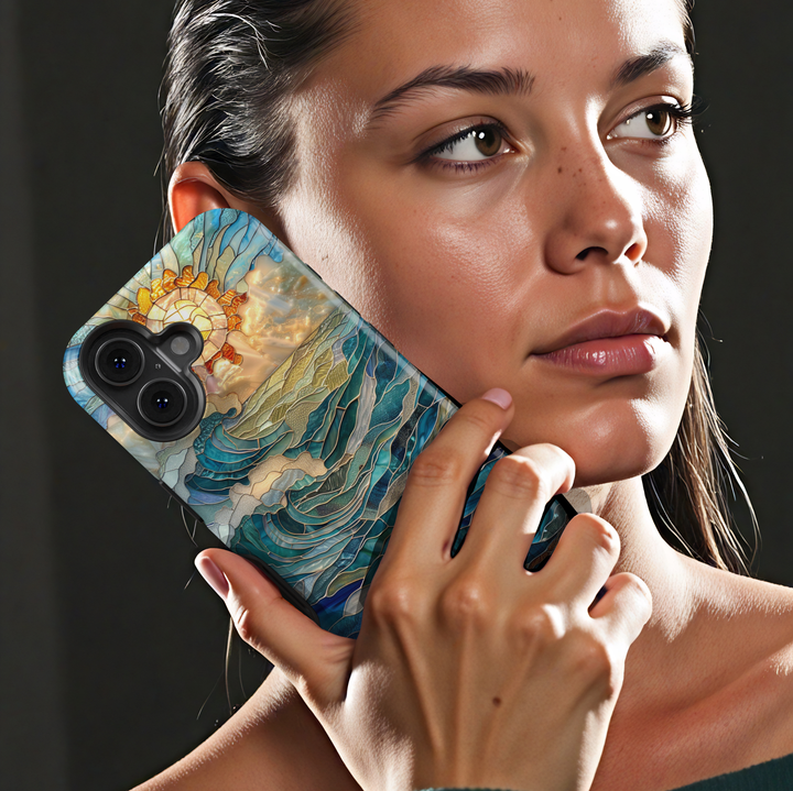 Ocean inspired stained glass art phone case with layered blue waves and golden sun on a protective iPhone and Samsung Galaxy phone case for women