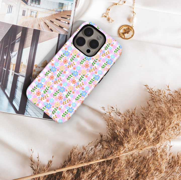 Pink gingham iPhone tough case with pastel flowers and green vines in a cute cottagecore pattern