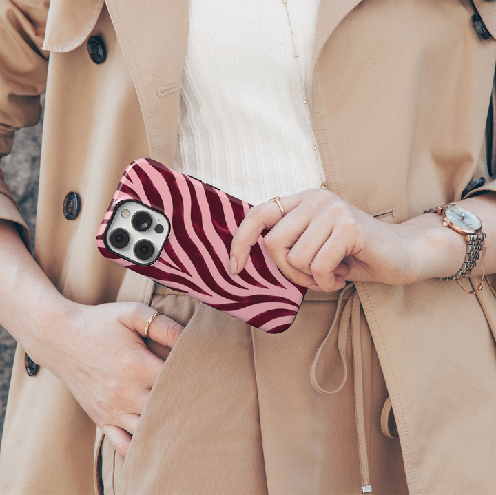 Wild Intentions burgundy zebra iPhone 18 Pro Max MagSafe case featuring deep burgundy, dark cherry, wine red and blush pink zebra stripes, a bold feminine protective tough iPhone 18 Pro phone case with a trendy animal print design and MagSafe compatibility.