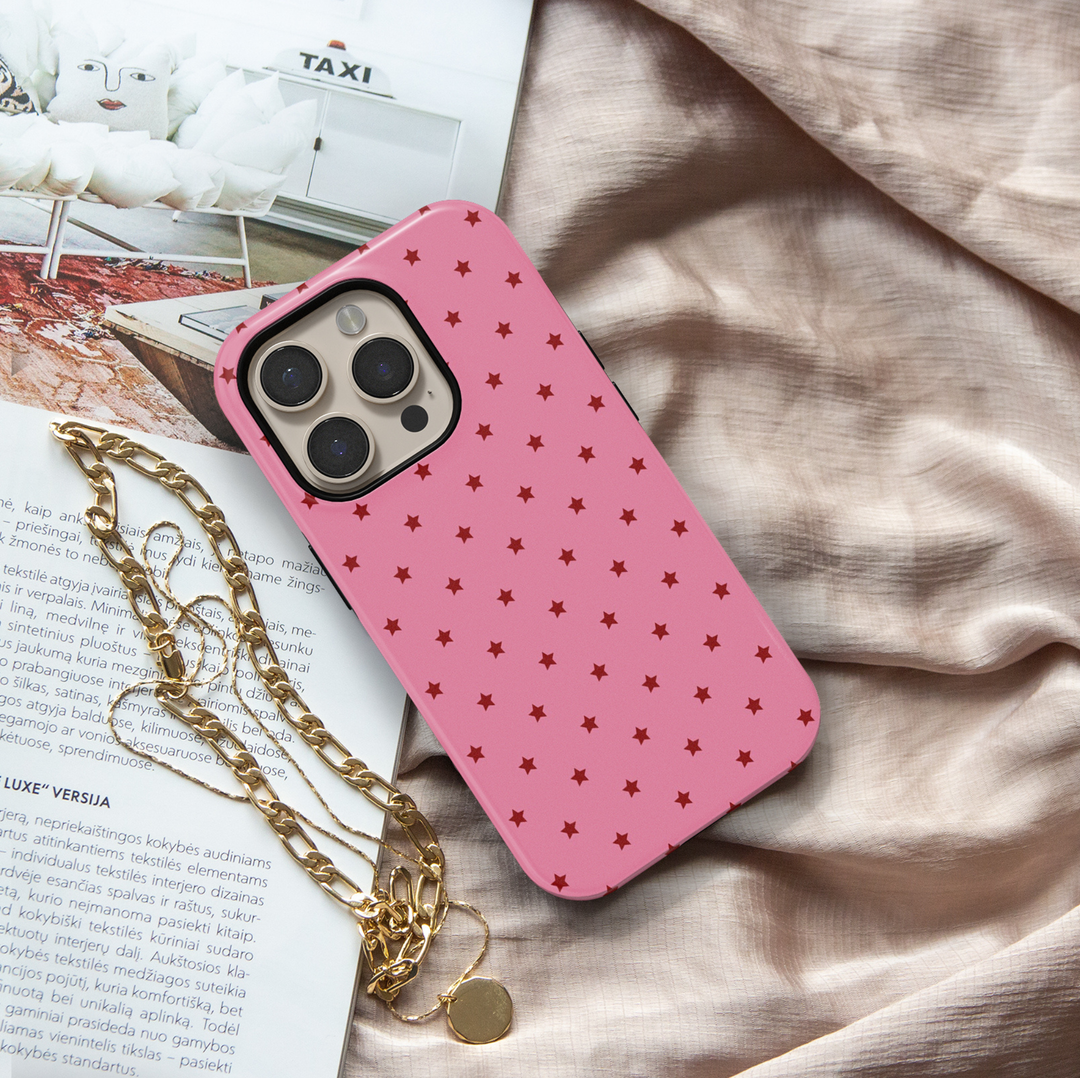 Starstruck pink iPhone 18 Pro Max MagSafe case with repeating deep red stars on a bubblegum pink background, a cute girly protective tough iPhone 18 Pro phone case featuring a minimalist celestial star pattern, pink and red aesthetic design and MagSafe compatibility.