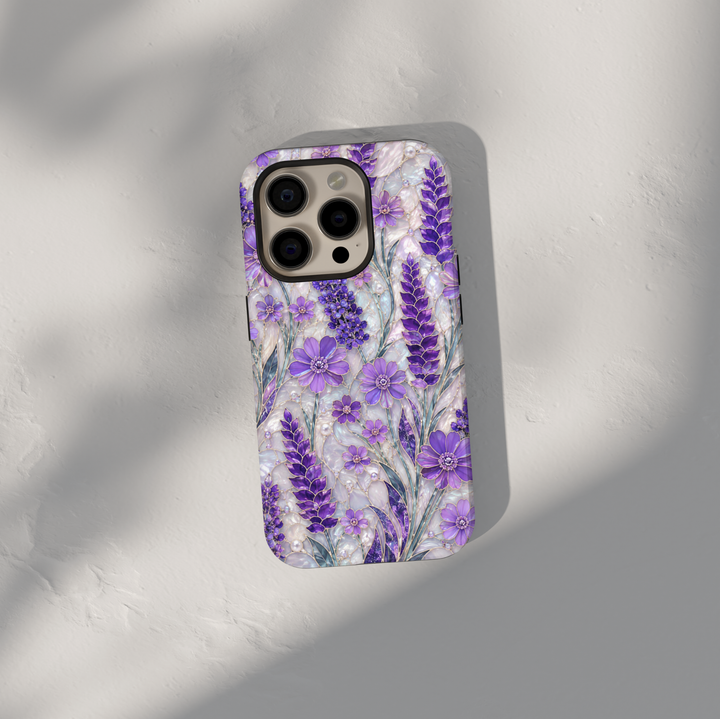 Purple lavender floral iPhone case featuring lilac wildflowers, pearl accents, botanical artwork, and elegant cottagecore aesthetic.