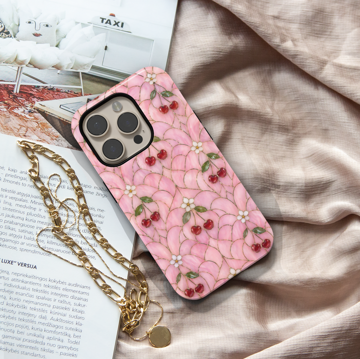 Pink cherry floral iPhone 17 Pro Max case with glossy red cherries and soft stained-glass aesthetic design.