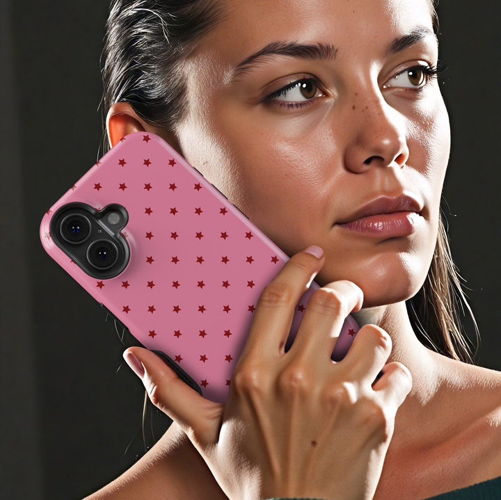 Starstruck pink iPhone 18 Pro Max MagSafe case with repeating deep red stars on a bubblegum pink background, a cute girly protective tough iPhone 18 Pro phone case featuring a minimalist celestial star pattern, pink and red aesthetic design and MagSafe compatibility.