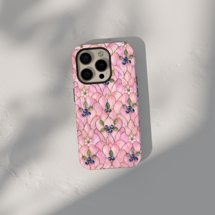 Pink floral iPhone 17 Pro Max case with delicate blossoms and blueberry accents in a soft aesthetic design.