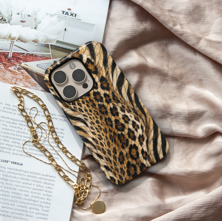 Golden Wild iPhone case with leopard and zebra animal print in black, caramel, cream and golden brown mosaic-inspired details.