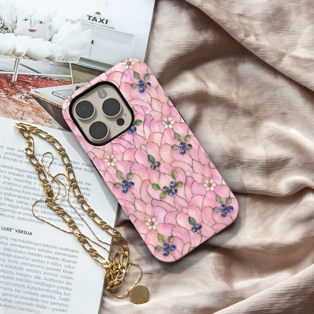 Pink floral iPhone 17 Pro Max case with delicate blossoms and blueberry accents in a soft aesthetic design.