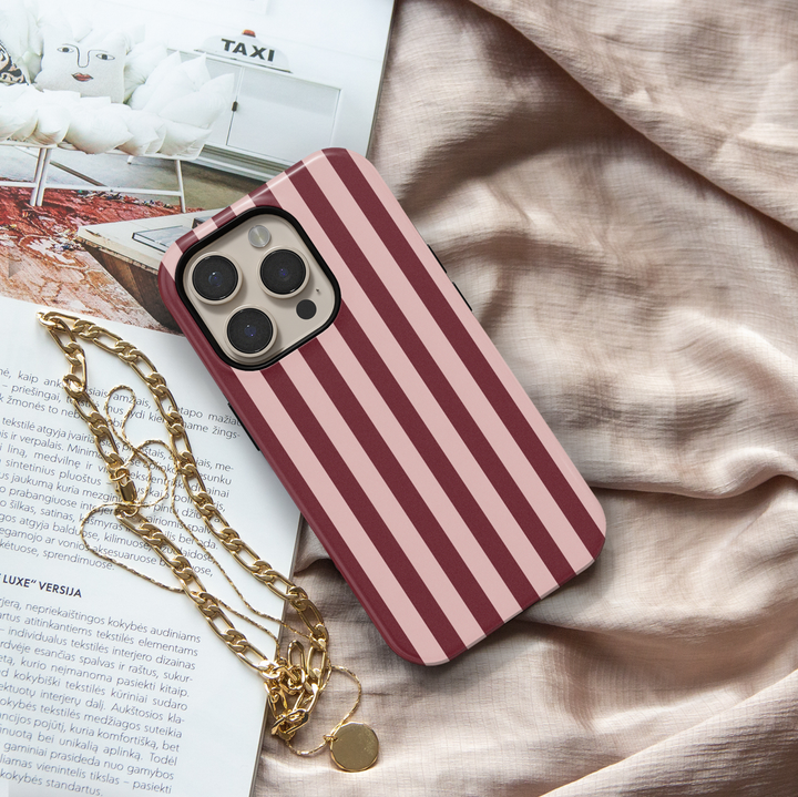 First Class burgundy striped iPhone 18 Pro Max MagSafe case featuring deep burgundy, wine red and muted blush pink vertical stripes, an elegant preppy protective tough iPhone 18 Pro phone case with a minimalist striped design and MagSafe compatibility.