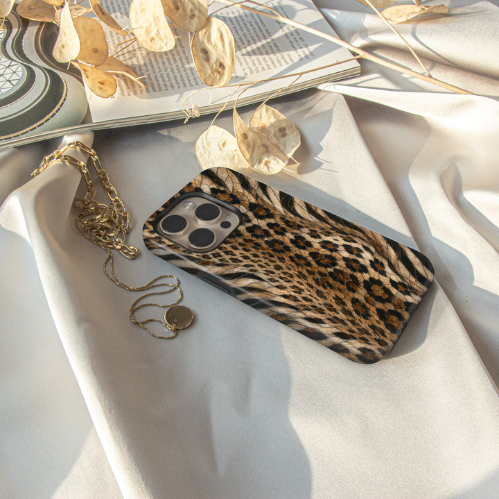 Golden Wild iPhone case with leopard and zebra animal print in black, caramel, cream and golden brown mosaic-inspired details.