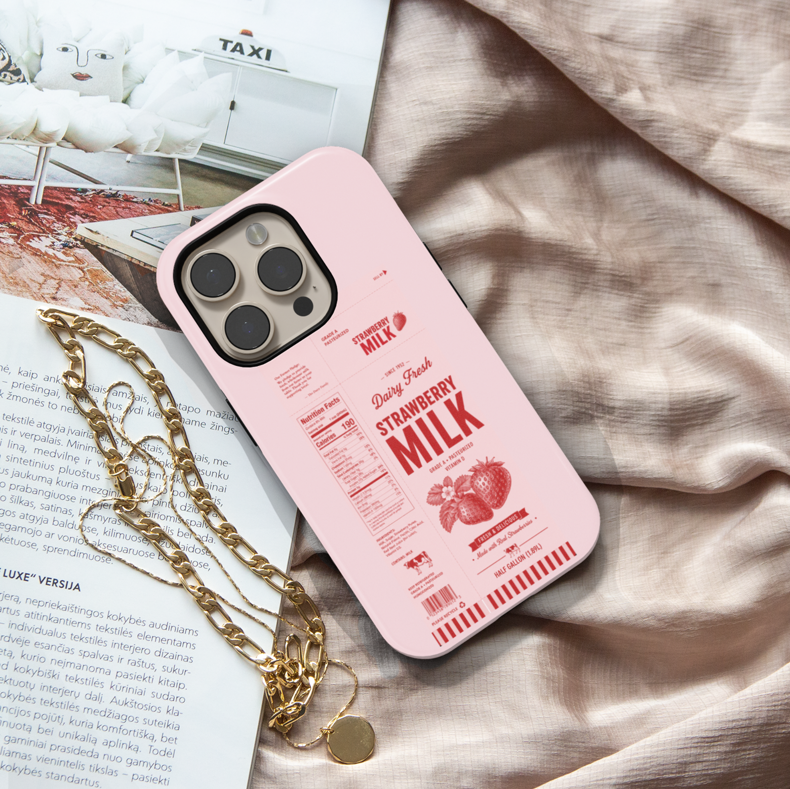 Pink strawberry milk carton inspired iPhone case featuring vintage dairy label artwork, nutrition facts, and retro strawberry illustrations.