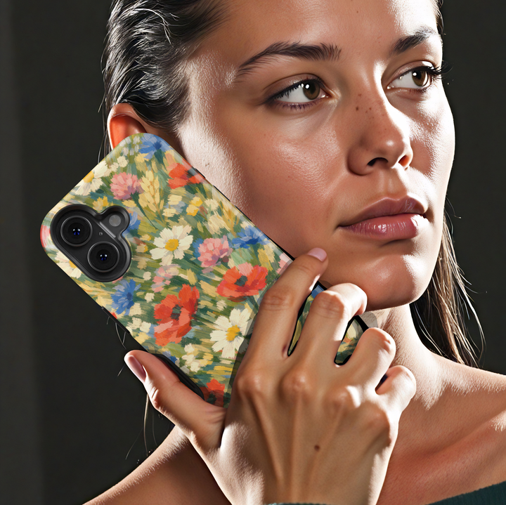 Impressionist wildflower iPhone case featuring colorful poppies, daisies, cornflowers, and meadow flowers in a painterly garden design.