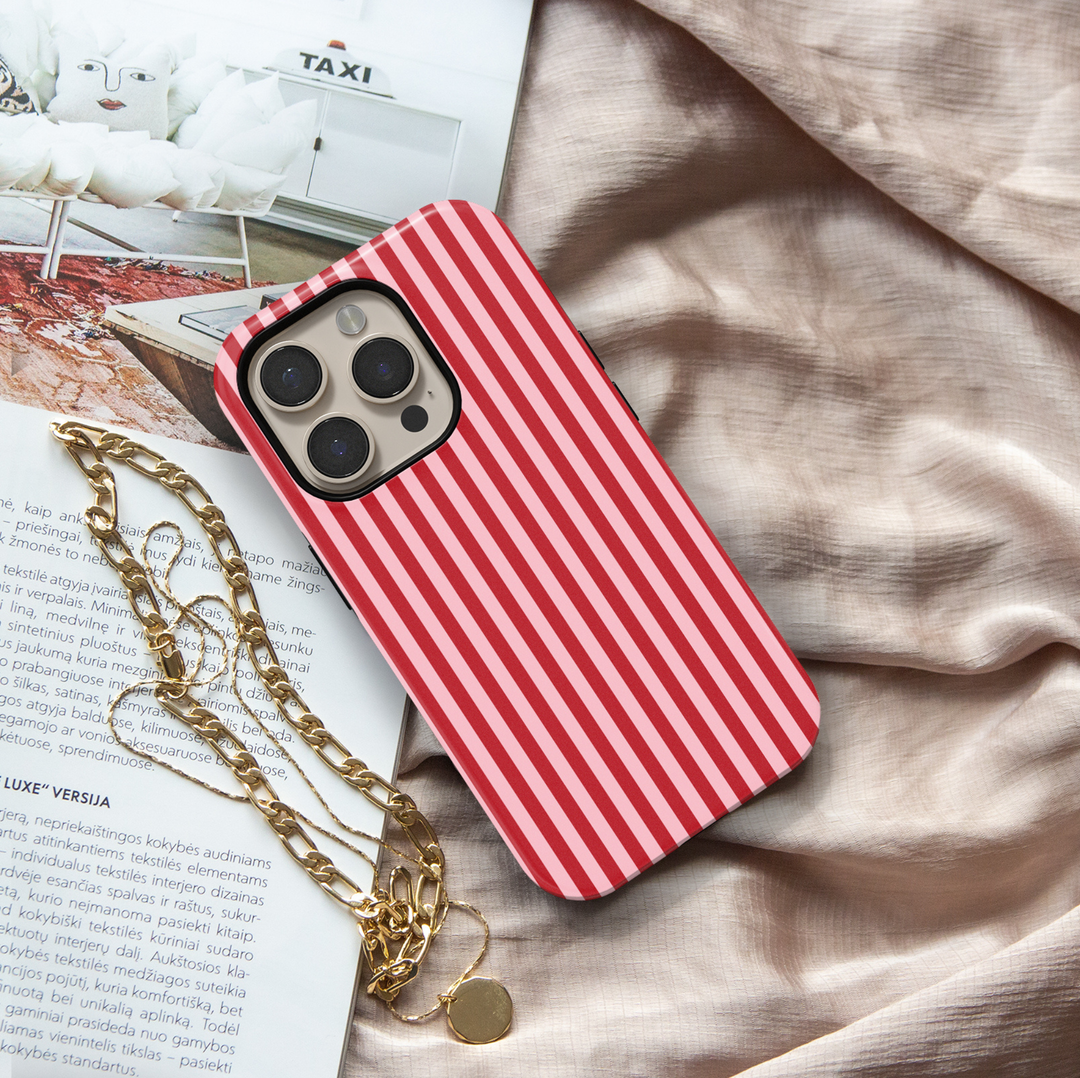 Candy Striper red and pink striped iPhone 18 Pro Max MagSafe case featuring alternating cherry red and soft blush pink vertical stripes, a cute preppy protective tough iPhone 18 Pro phone case with a feminine retro striped design and MagSafe compatibility.