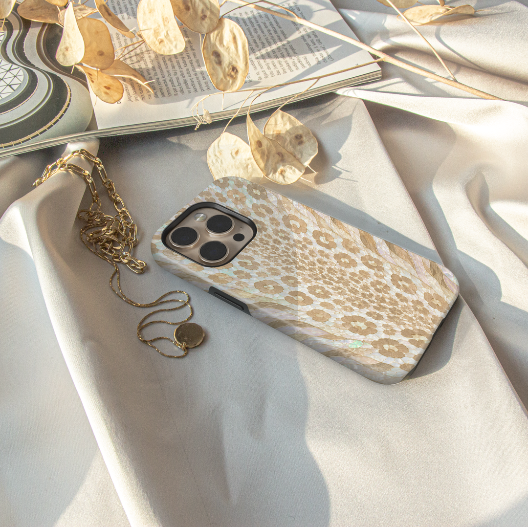 Pearl Snow Leopard iPhone case with ivory, cream and champagne beige leopard print in an opal pearl-inspired design.