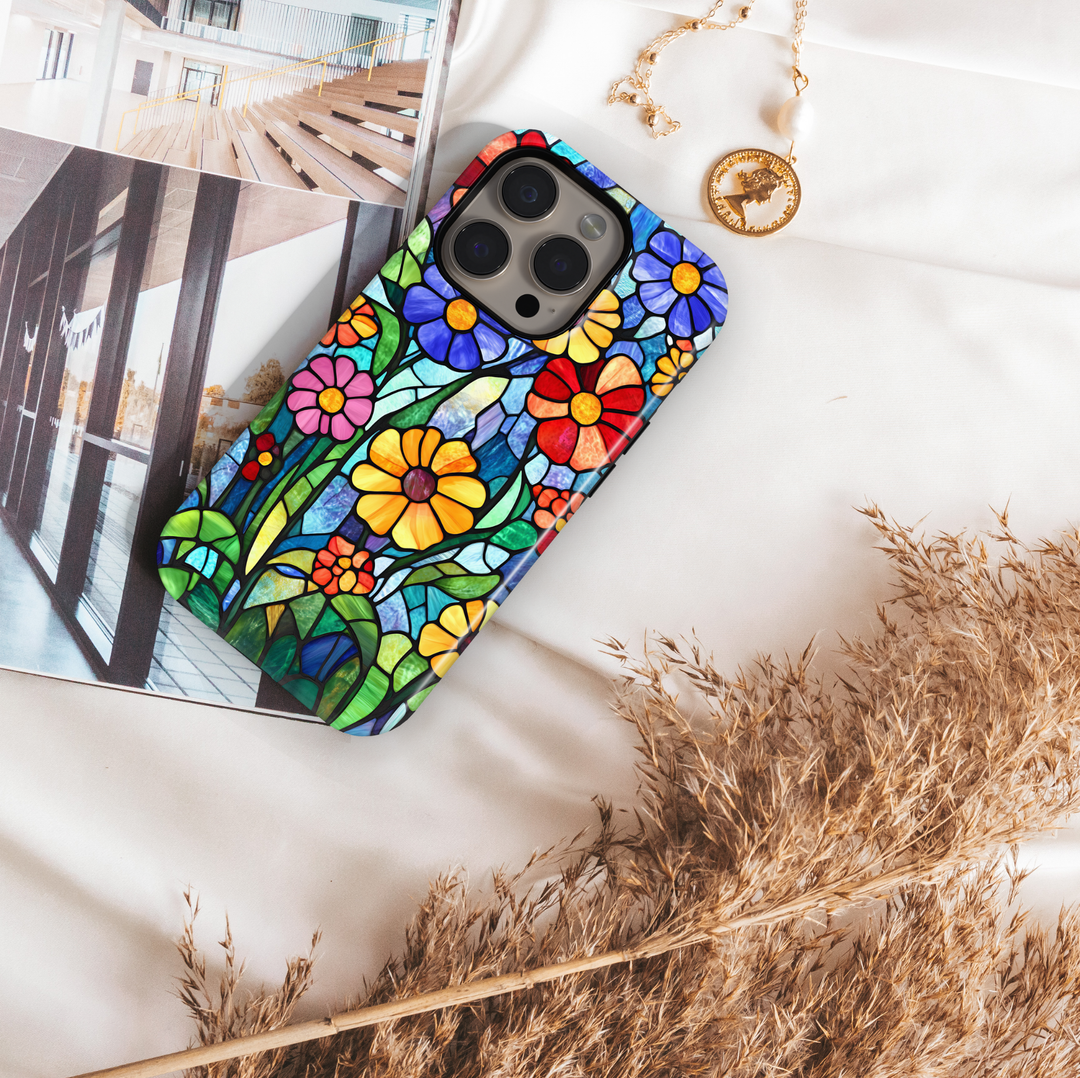 Colorful stained glass floral iPhone tough case with layered flowers and deep blue mosaic background
