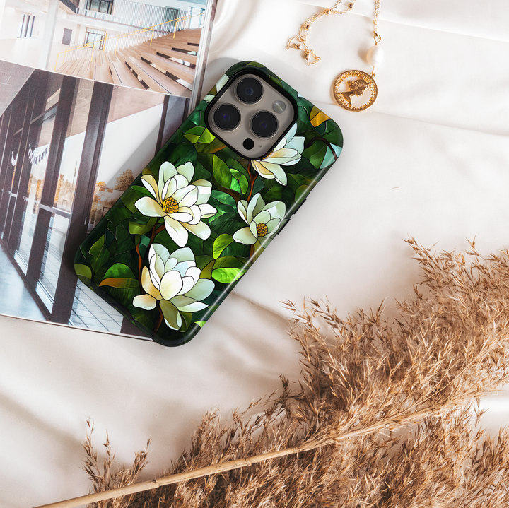 Stained glass magnolia floral iPhone tough case with white flowers and layered green leaves