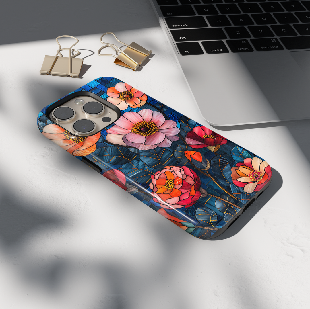 Colorful stained glass floral iPhone tough case with layered flowers and deep blue mosaic background