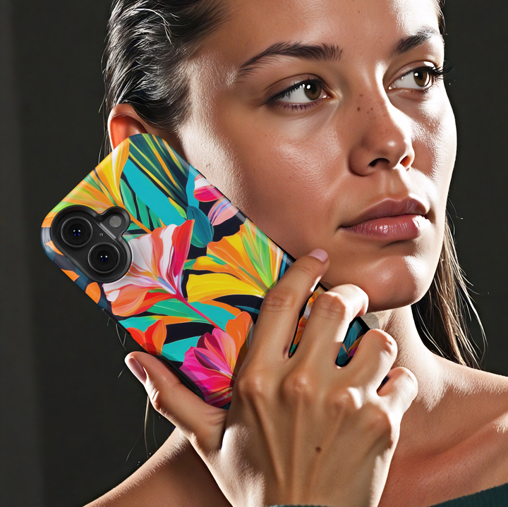 Colorful tropical floral iPhone case featuring vibrant orange, pink, yellow, and teal flowers on a dark botanical background.