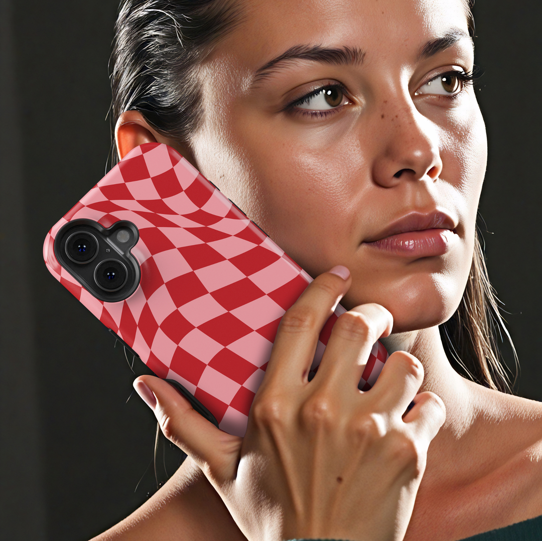 Check Mate red and pink checkerboard iPhone 18 Pro Max MagSafe case featuring a warped wavy checkered pattern in cherry red and blush pink, a cute retro protective tough iPhone 18 Pro phone case with a bold aesthetic checkerboard design and MagSafe compatibility.