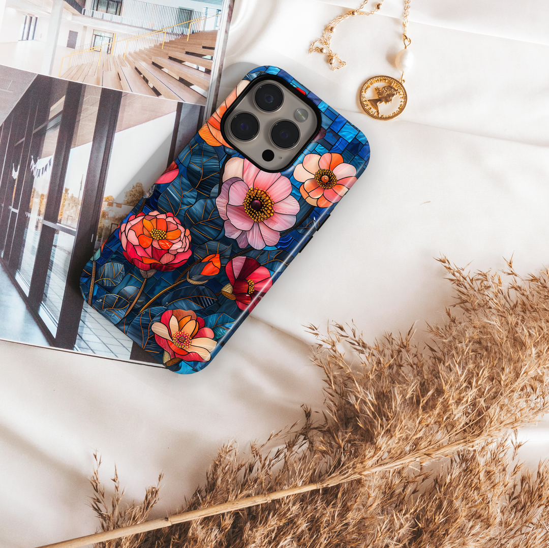 Colorful stained glass floral iPhone tough case with layered flowers and deep blue mosaic background
